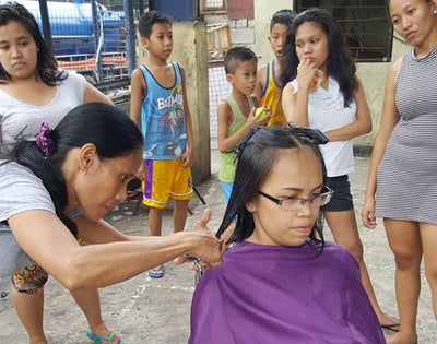 Hairdressers herald hope for slum-living parents
